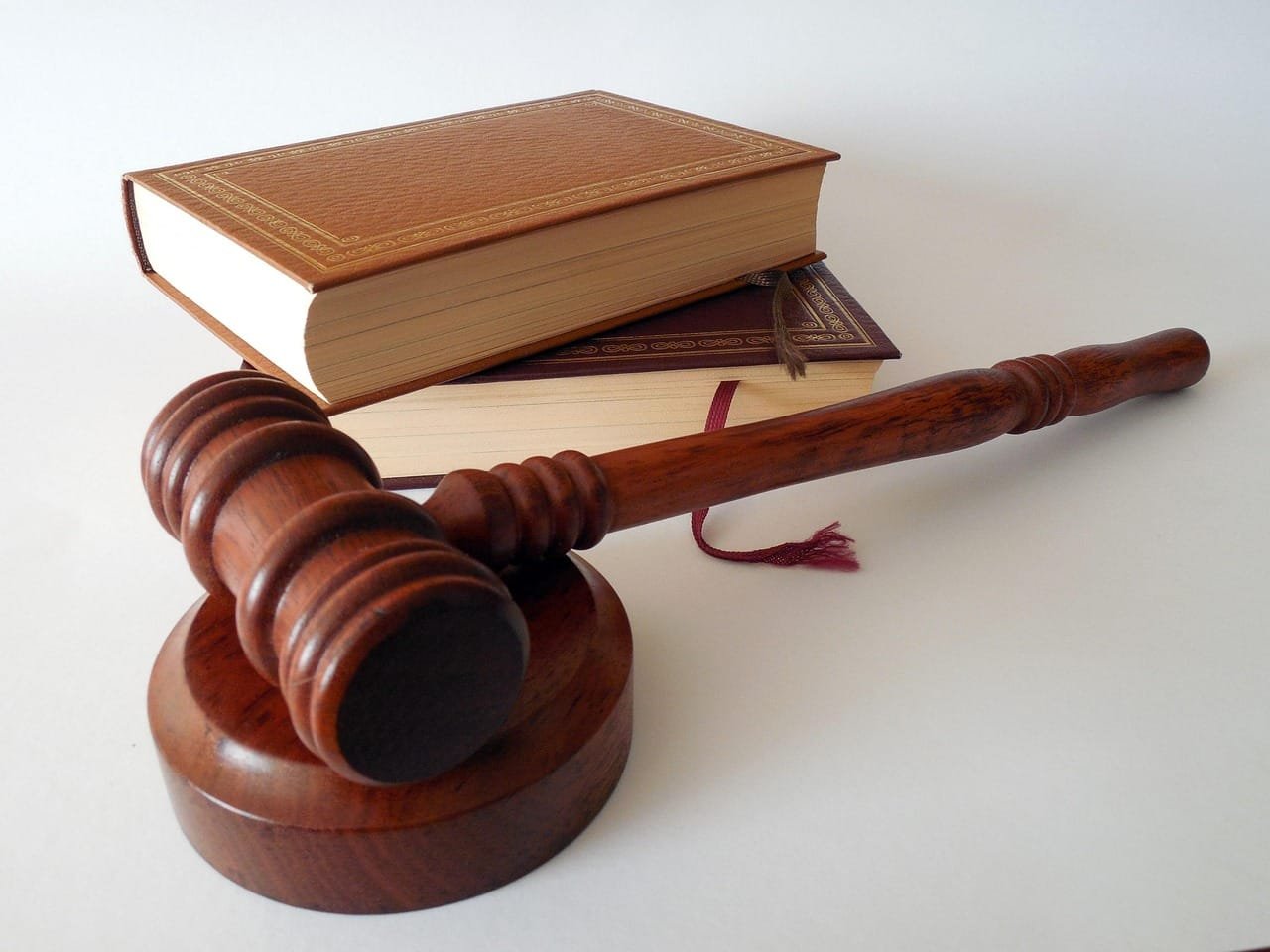 Neoliberal law is described as reconfiguring democratic conflict