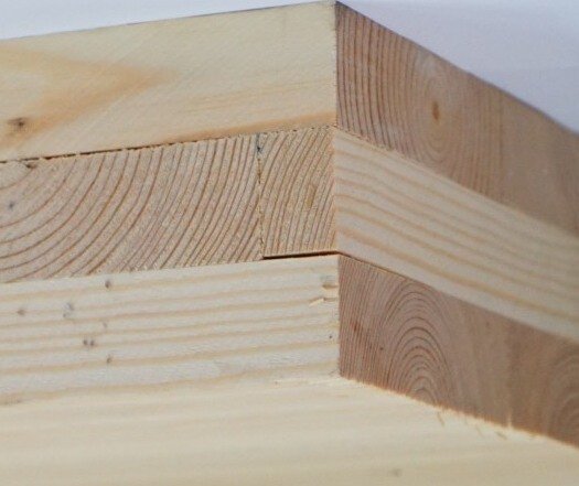 Beam integration reduced low-frequency impact noise in CLT floors